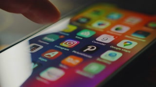 London, England. 07-30-2024. Person scrolling in the Instagram App 2