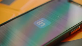 London, England. 07-30-2024. Person scrolling in the Linkedin App 